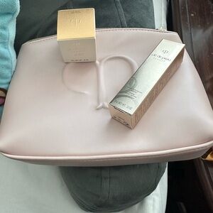 New cle de peau pink pouch with luxury skincare